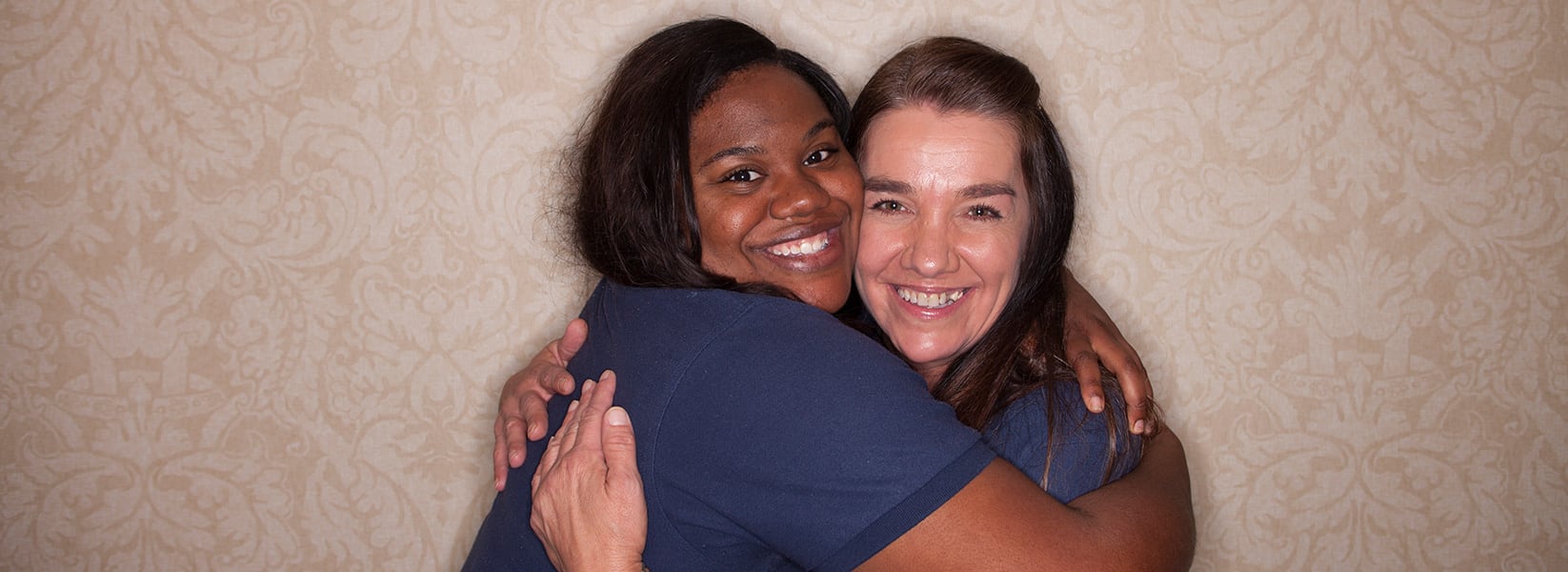 Two women hugging