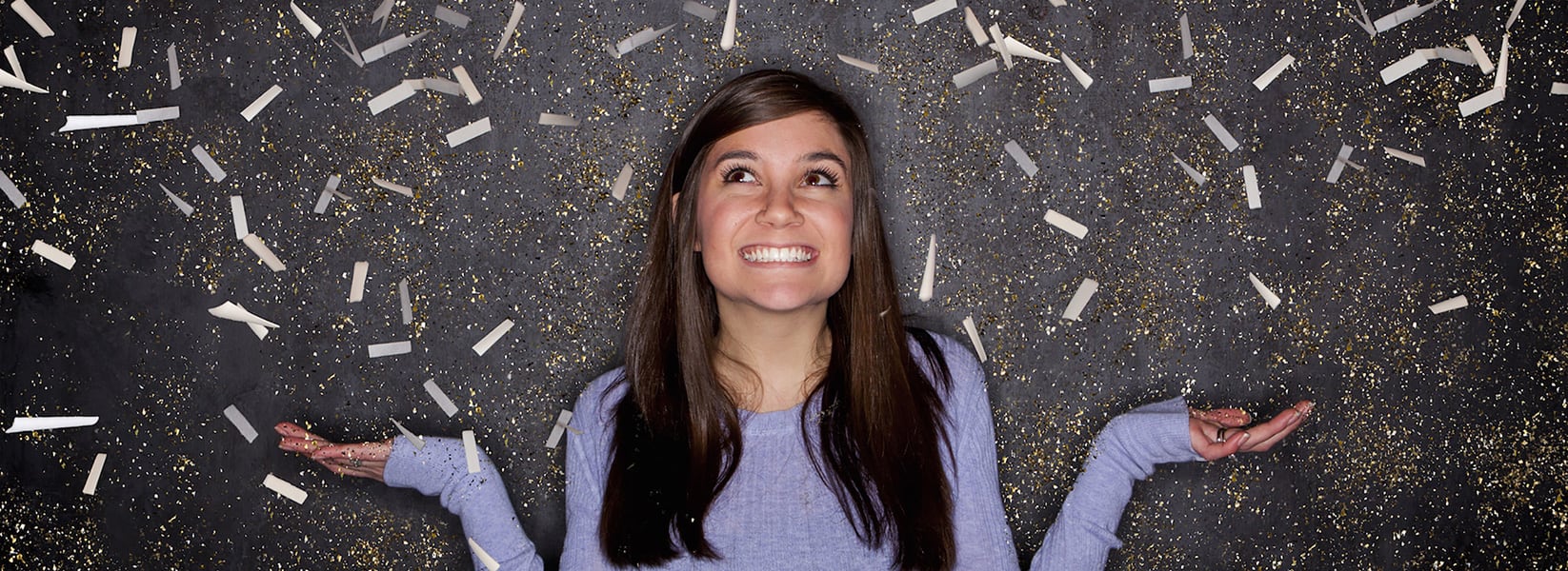Woman standing in glitter shower
